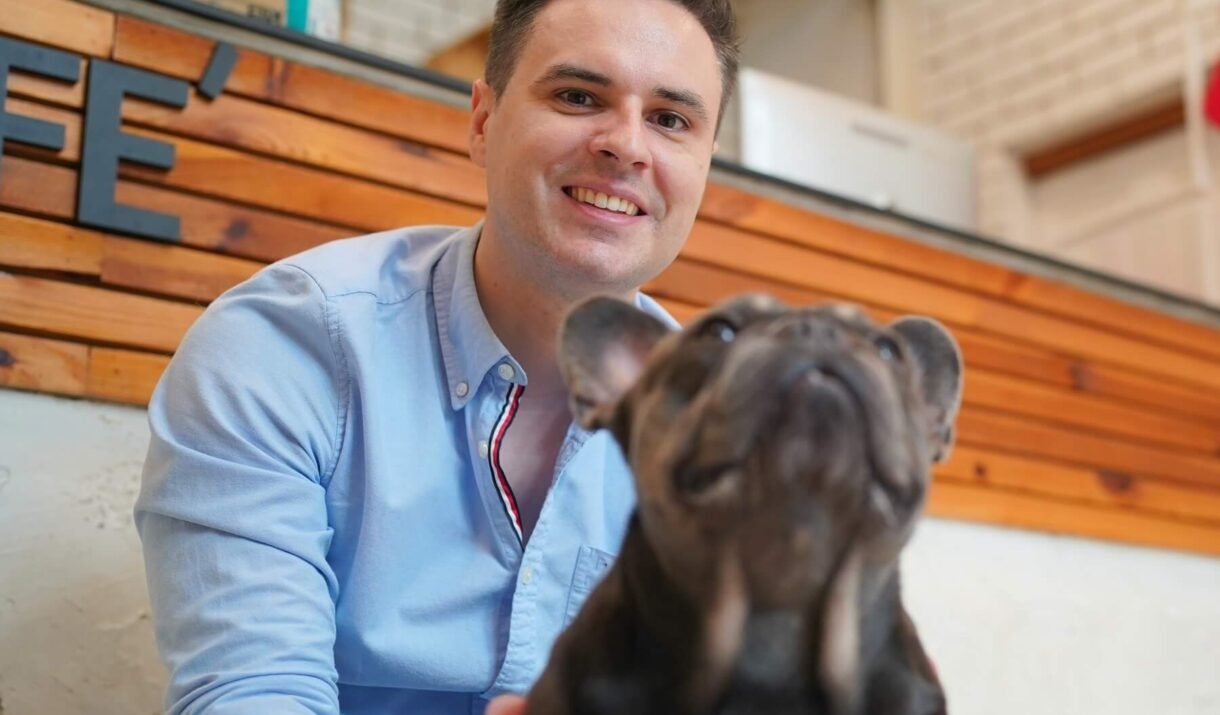 man and with his pet dog playing on the floor hap 2022 11 14 09 04 35 utc cropped
