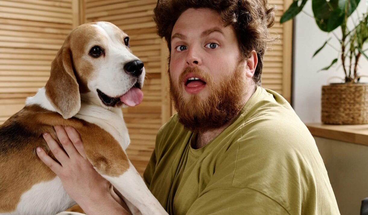man fooling around with his pet 2022 05 02 15 33 57 utc cropped